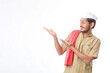 © PRASANNAPIX - young indian man in traditional wear and showing direction on white background