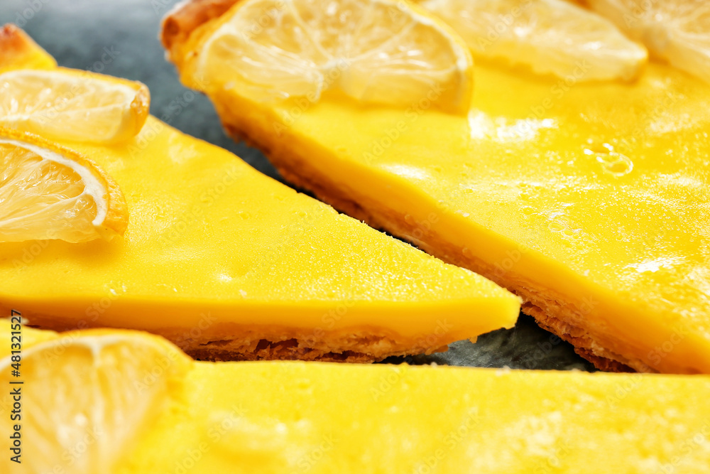 Tasty lemon tart on board, closeup
