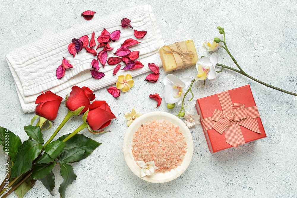 Beautiful spa composition with roses for Valentine's Day celebration on light background