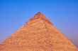The pyramid of Khafre with blue sky on the background.