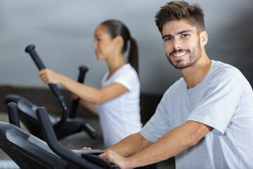 people running in machine treadmill at fitness gym club