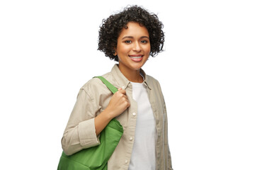 Wall Mural - eco living, zero waste and sustainability concept - portrait of happy smiling woman with green reusable canvas bag for food shopping over white background