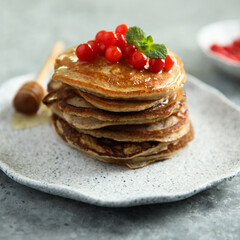 Canvas Print - Homemade pancakes with berries and honey