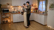 © PRPicturesProduction - full length of happy asian couple hugging and dancing together while celebrating valentine’s day on romantic night date at a decorated home interior