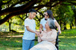 © Prot - Happy senior Asian grandmother uses wheelchair with her daughter and grandchild in park, Grandson came to visit elderly grandmother and hold hand. Concept of happy family, good relationship together