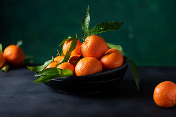 Wall Mural - Fresh mandarins with green leaves