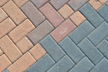 Close Up Of Coloured Blocks In Concrete Pavement 