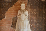 Fototapeta Sypialnia - A Buddha Image in a Small Pagoda in Bagan, Myanmar