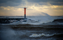 Lighthouse On A Windy Storm On A Baltic Sea At Winter With Clouds In The Sky