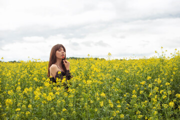 Young woman in spring field