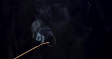 Smoke Rises In Slow Motion From A Burning Incense Stick As Ashes Build Up And Then Fall
