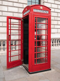 Fototapeta Londyn - Red telephone box. Traditional iconic booth or kiosk in London, England, United Kingdom.