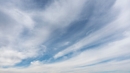 Wall Mural - heavier white clouds and blue sky suitable for background or sky replacement