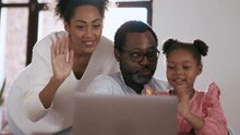 Smiling African Family Talking By Video Call On Laptop At Home