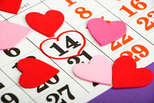 Close Up Calendar With Date Stamped Valentines Day February 14 And Pink And Red Decorative Hearts