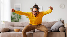 Overjoyed Excited Young African American Man Celebrating Goal While Watching Football Match On Tv