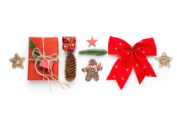 Canvas Print - Christmas composition. Gift boxes with stars, red ,bow and gingerbread cookie on white background