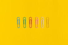 Paper Clips On Yellow Background. Top View. Flat Lay. Back To School.