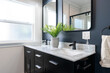 Detail of modern bathroom vanity with marble counter top, double sinks with black faucets, black cabinetry and matching black framed mirrors.