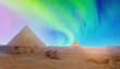 Mysterious and mystical view of Egyptian pyramids of Cheops with northern lights in sky Cairo Egypt