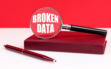 Poster - On a white and red background, a notebook, a pen and a magnifying glass, inside which the inscription - Broken Data