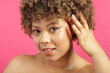 © Cultura Creative - Studio shot of woman on pink background
