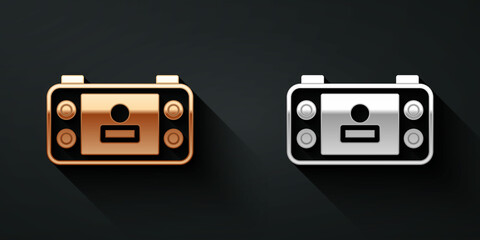 Poster - Gold and silver Portable video game console icon isolated on black background. Handheld console gaming. Long shadow style. Vector