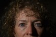 Close up portrait of middle aged caucasian woman with curly hair.  