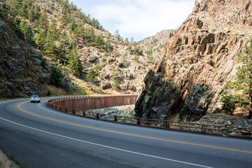 Big Thompson River canyon and highway bridge in sunny daytime