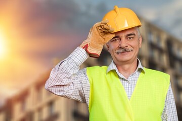 Wall Mural - Male engineer handsome man or architect looking construction with safety helmet