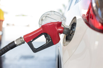 Refill and filling Oil Gas Fuel at station. Gas station refueling. To fill the machine with fuel. Car fill with gasoline at a gas station. Gas station pump.