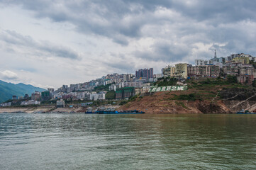 Wall Mural - Yangtze River, China - Landscape, cruise ships and towns on both sides of the Three Gorges of the Yangtze River, China, May 31, 2011.