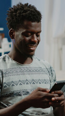 Poster - Person using smartphone with touch screen for text messages and remote communication. Man holding gadget and texting, talking to friends as free time activity after online work.