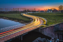 Curve Light Trails On Country Road In The Landscape Of The Province Of Groningen, The Netherlands