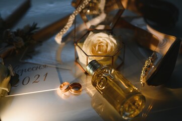 Wall Mural - gold rings and a beautiful bridal bouquet of roses on the background. details, wedding traditions. close-up, macro