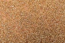 Bright Golden Glass Beads As Background, Top View
