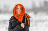Fototapeta Abstrakcje - Young woman in wintertime