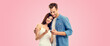 © vgstudio - Love, relationship, new parents and happy family concept - young couple, finding out results of a pregnancy test, isolated on pink background. Copy space for some text.