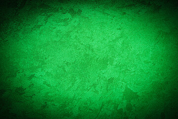 Texture of green decorative plaster or concrete with vignette.