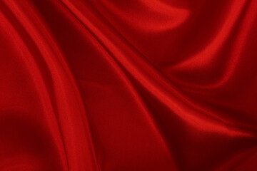 Dark red fabric texture background, detail of silk or linen pattern.