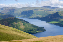 Views Of Ullswater With The Summits Of Hallin Fell On The Left, Green Hill On The Right And Stybarrow Dodd In The Distance In The English Lake District, England, UK.