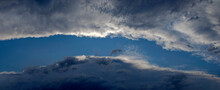 Tunnel In The Clouds - Panorama Of Clouds That Have Arranged Themselves In An Oblong Shape Creating A Tunnel