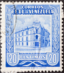 Wall Mural - Venezuela - circa 1953: a postage stamp from Venezuela, showing the Main Post Office Caracas building