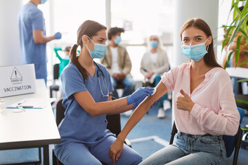 Wall Mural - Woman Preparing To Get Vaccinated Against Covid-19