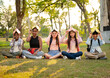 © chachamp - Student sit down and holding book on head with sunset at the school park
