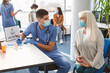 © Prostock-studio - Doctor Talking With Mature Woman Before Vaccination In Hospital