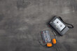 Music listening concept. Vintage cassette tape, audio player and headphones close-up on grey concrete background, top view.