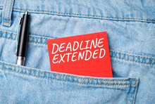 The Back Pocket Of Blue Jeans Contains A White Pen And A White Red Card With The Text DEADLINE EXTENDED