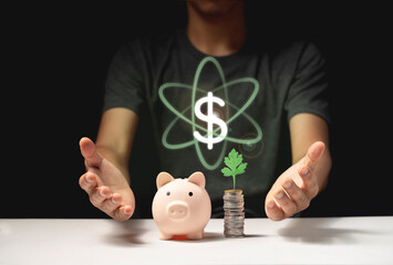 piggy bank saving money concept. with a coin and a dollar symbol between two hands