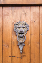 Wooden Door With Ornate Metal Lion Door Knocker